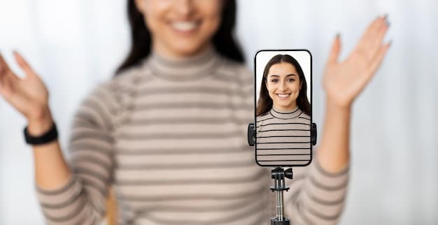 A mobile screen showing a TikTok Live with the creator pointing at a comment and saying the viewer's name with a big smile. The background is blurred, focusing attention on the interaction element.