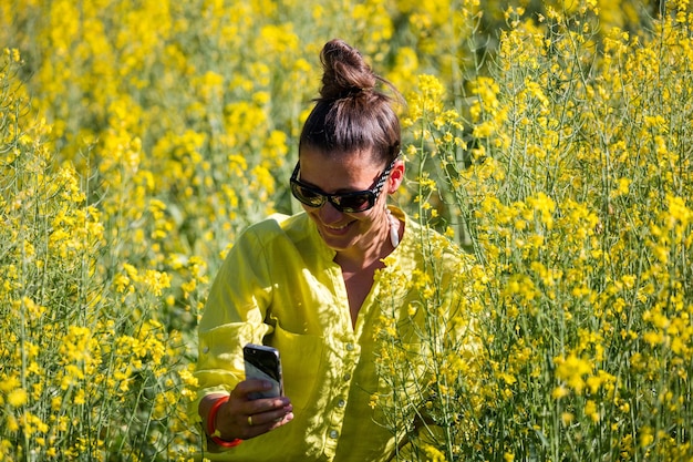 An Instagram post featuring a blogger in a sunny yellow dress, posing in a field of wildflowers. The image radiates joy and optimism with the vibrant color and natural setting.