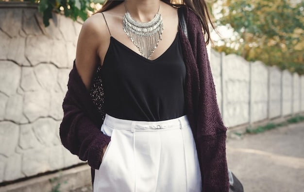 A woman wearing a Shein blouse with tailored trousers and accessorized with a simple necklace and watch. The outfit is professional and stylish, showcasing how to elevate budget-friendly pieces with the right accessories.