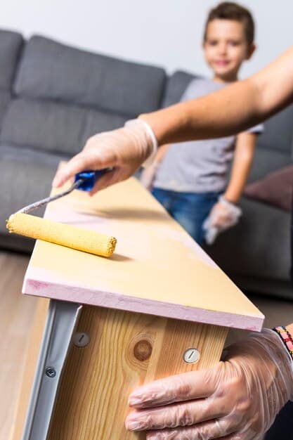A pair of hands meticulously painting a recycled wooden crate, implying a DIY home improvement project, with a blurred background of a cozy, organized living space.