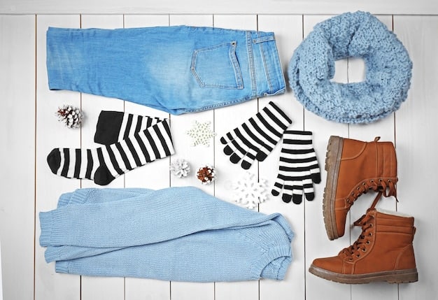 A flat lay of a minimalist, versatile capsule wardrobe including classic pieces like a white shirt, black trousers, a denim jacket, and a striped tee, with a few interchangeable accessories.
