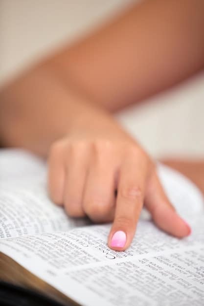 A close-up shot of a hand highlighting a specific grammar rule in a style guide manual with a yellow marker, symbolizing attention to detail. The rule is clearly visible and relevant to Decoding the complexities of style guides.