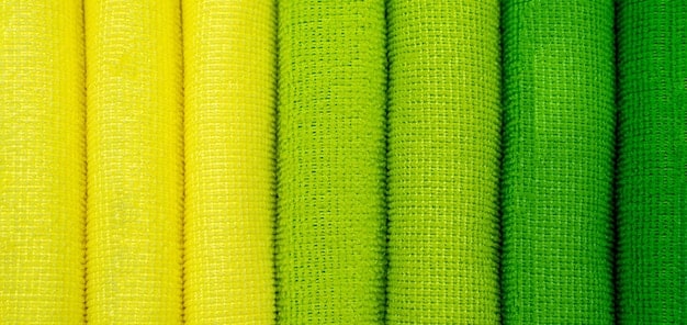 A close-up shot of various chartreuse-colored fabrics and textures, including silk, wool, and cotton. The image showcases the different shades and intensities of chartreuse and show how diverse How to Style the Season's Hottest Color: A 2025 Guide to Incorporating Chartreuse into Your Wardrobe, can be.