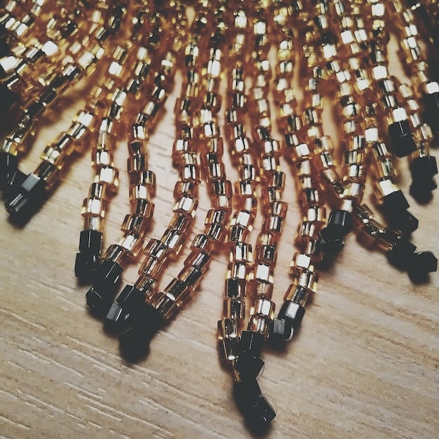 A close-up photo featuring a collection of various necklaces, including delicate chains, statement pendants, and layered pieces on a velvet display. The focus is on the texture and design of each necklace, highlighting their potential to enhance an outfit as part of The 2025 Guide to Accessorizing.