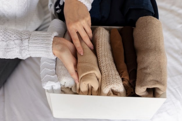 A close-up shot of a person's hands selecting clothing items from a well-organized closet. The clothing items showcase a consistent color palette and style, reflecting a curated and cohesive wardrobe typical of someone who has discovered their personal style. The image illustrates the practical benefits of The 2025 Guide to Finding Your Personal Style: A Journey of Self-Expression, emphasizing organization and intentionality.