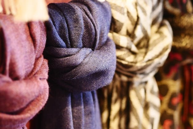 A close-up shot showcasing a variety of scarf fabrics, including silk, wool, and cashmere. The fabrics are draped and arranged to highlight their textures and colors, illustrating fabric choices for how to style a scarf: a 2025 guide to versatile fashion.