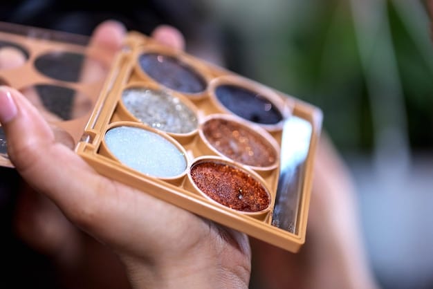 A hand holding a variety of small sample-sized makeup products from Sephora, including miniature lipsticks, foundation vials, and skincare creams. The background is a blurred image of Sephora shelves.