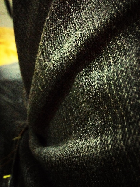 A close-up shot of a Zara garment from the 2025 haul, highlighting the fabric texture and stitching details. The image should focus on the quality of the material and craftsmanship, showcasing elements that contribute to the garment's overall look and feel. Include a reference to 'Trying on the Latest Zara Clothing Haul: A 2025 Style and Fit Review' in the image's alt text.]