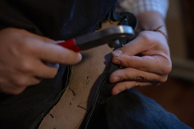 A shoemaker's hands carefully stitching leather on a designer shoe. The lighting is focused to highlight the precise movements and the quality of the materials. Tools and other shoe components are visible in the background.