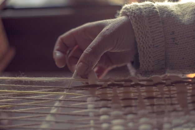 Close-up shot of a garment worker's hands using traditional weaving techniques to create sustainable fabrics. The focus is on the craftsmanship and the worker's dedication to their craft. Is the skill being appropriately valued?